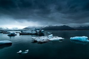 glacier near body of water